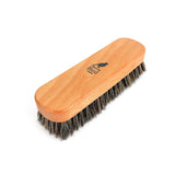 Wooden brush with bristles on a white background