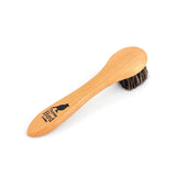Wooden brush with bristles on a white background