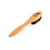 Wooden brush with black bristles on a white background
