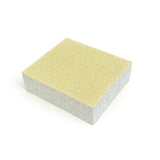 Square foam block with textured surface on a white background